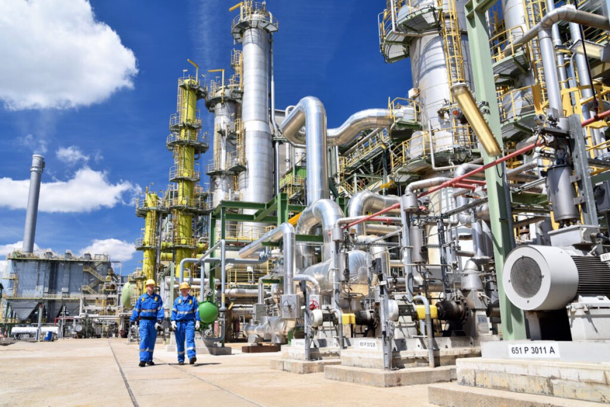 chemical industry plant - workers in work clothes in a refinery